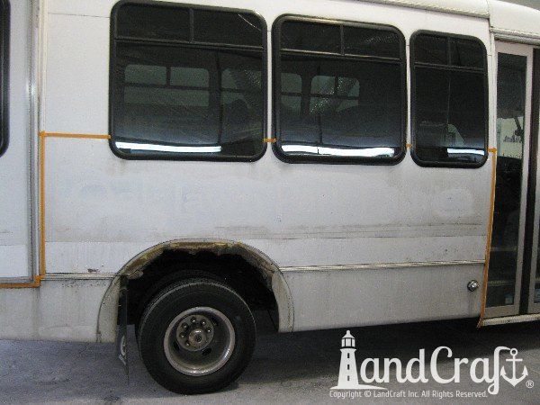 Fiberglass bus damage requiring repair and refinishing