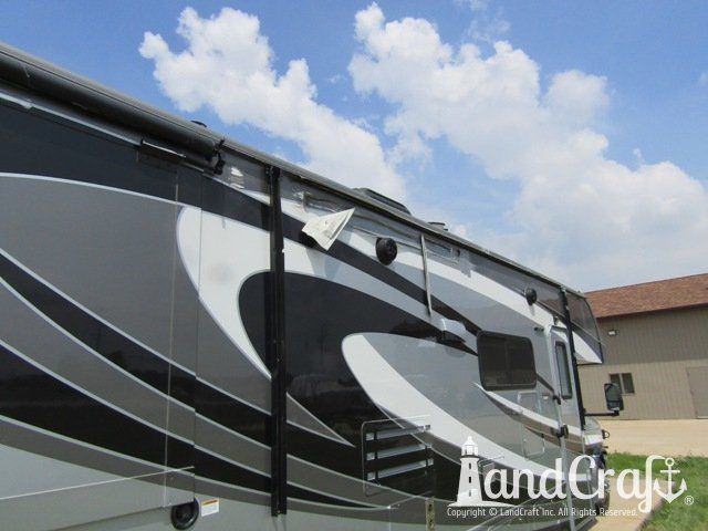 Forest River RV with side damage and tear punctured through due to an accident