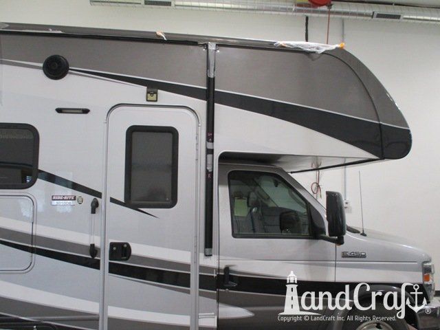 Forest River RV with side damage and tear punctured through due to an accident