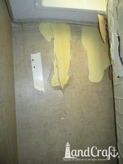 Forest River RV with damage being repaired inside bathroom wall
