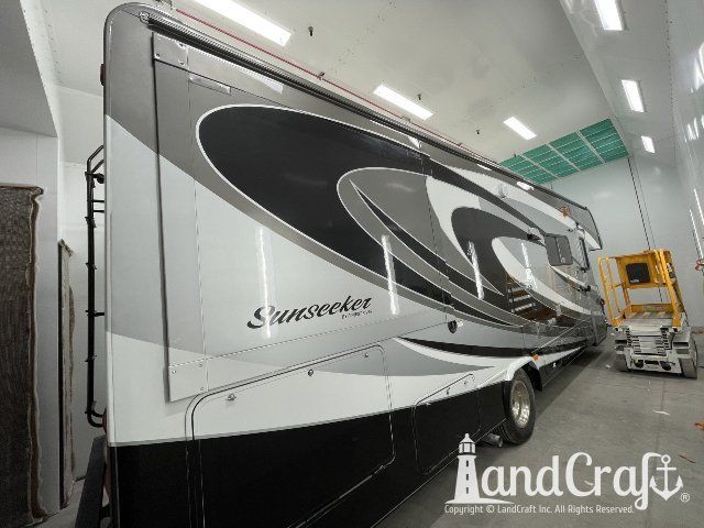 Forest River RV in the LandCraft paint booth after multiple colors of paint graphics applied