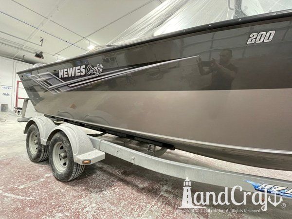 Picture of the repaired and refinished aluminum Hewescraft boat