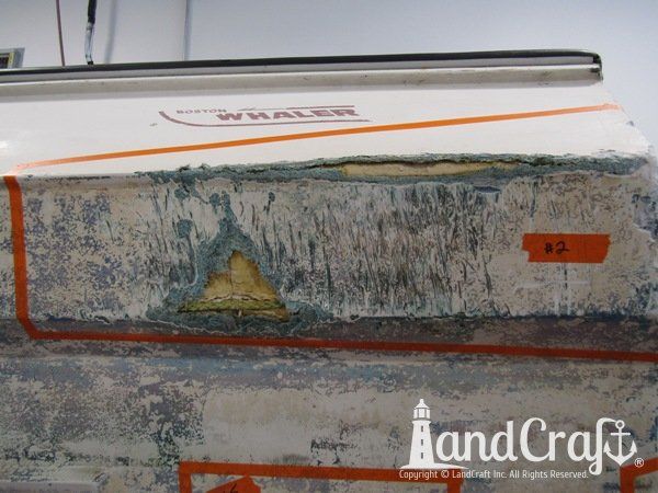 Grounding damage with holes on bottom hull of a fiberglass Boston Whaler boat