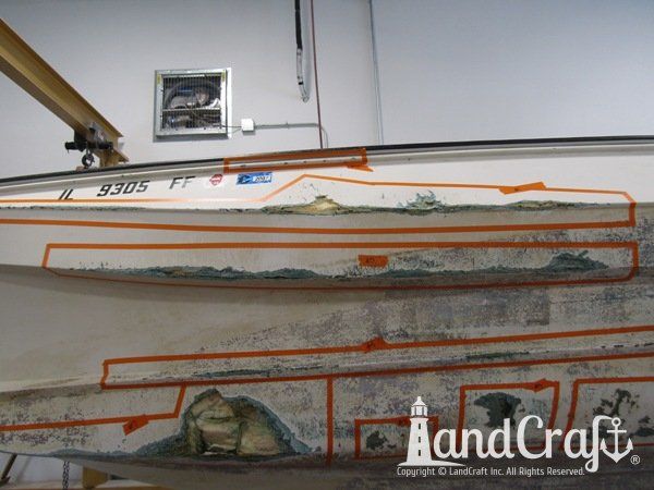 Grounding damage with holes on bottom hull of a fiberglass Boston Whaler boat