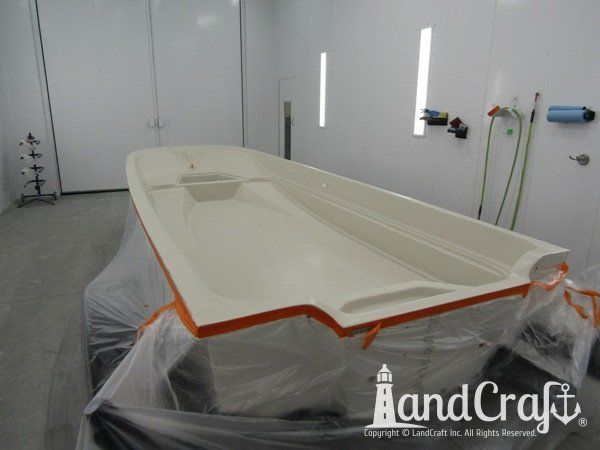Boston Whaler in the LandCraft paint booth for gelcoat work on the upper decking