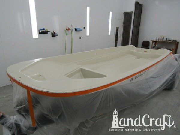 Boston Whaler in the LandCraft paint booth for gelcoat work on the upper decking