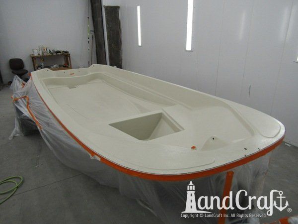 Boston Whaler in the LandCraft paint booth for gelcoat work on the upper decking