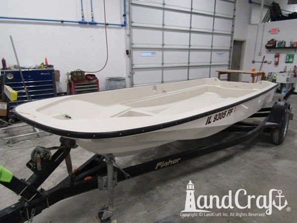 Boston Whaler with repairs completed on the bottom hull and top deck