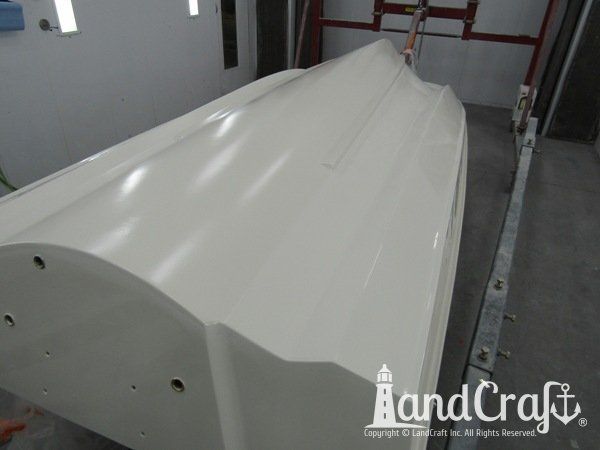 Boston Whaler in the LandCraft paint booth for gelcoat work on the bottom hull