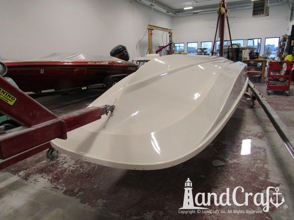 Boston Whaler with gelcoat refinishing completed on the bottom hull
