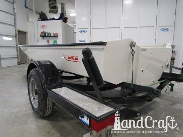 Boston Whaler with repairs completed on the bottom hull and top deck