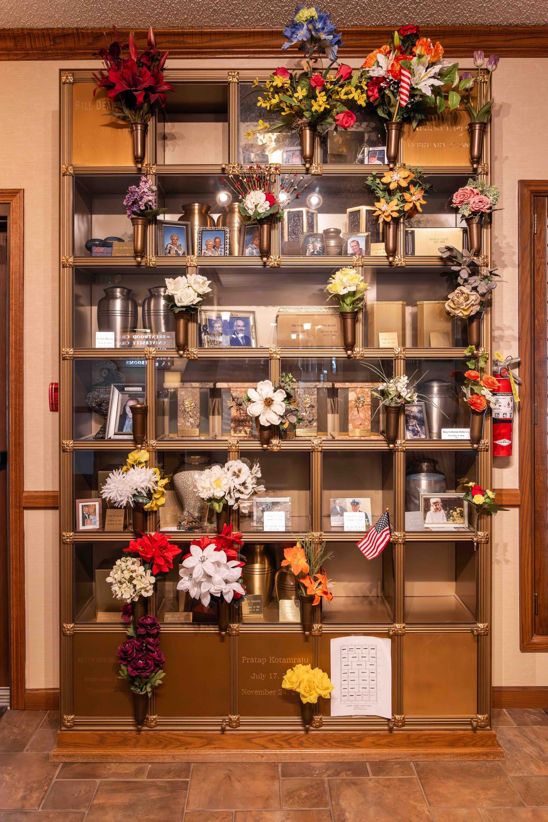 A cemetery filled with lots of vases and flowers
