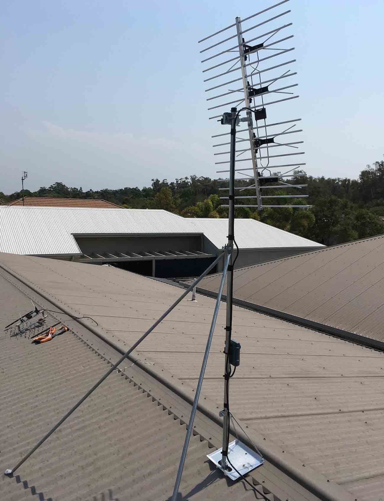 A Large Antenna is Sitting on Top of a Roof — Garrow's TV & Antenna Services in Caloundra, QLD