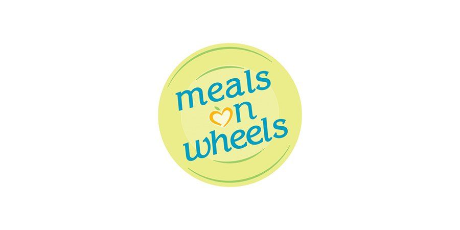 A yellow circle with the words `` meals on wheels '' written on it.