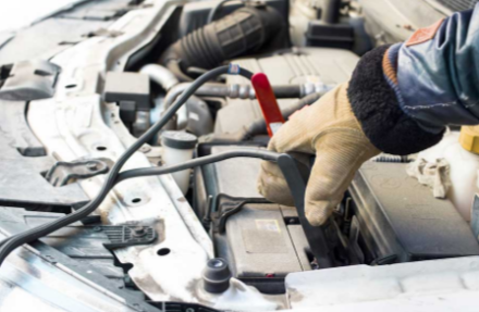 Picture of Guy with Gloves Using Jumper Cables
