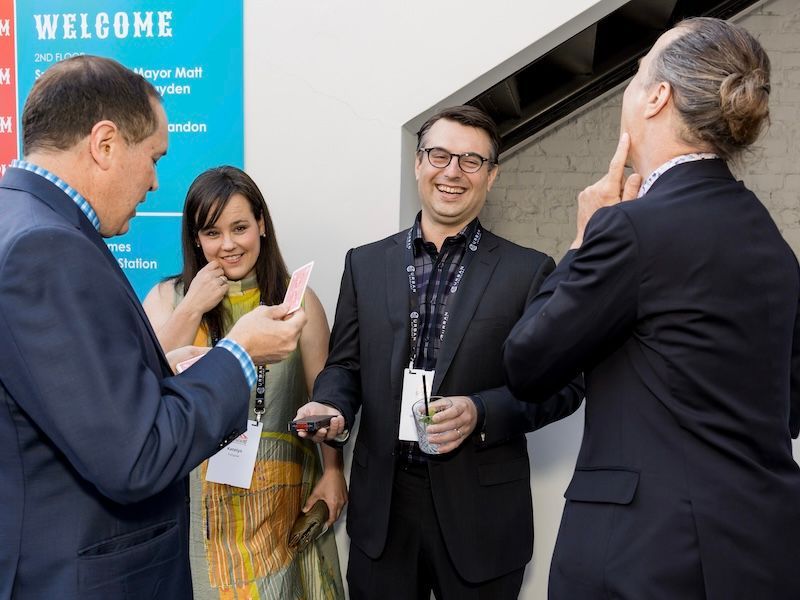 San Francisco corporate magician David Martinez performs close-up magic at a company party