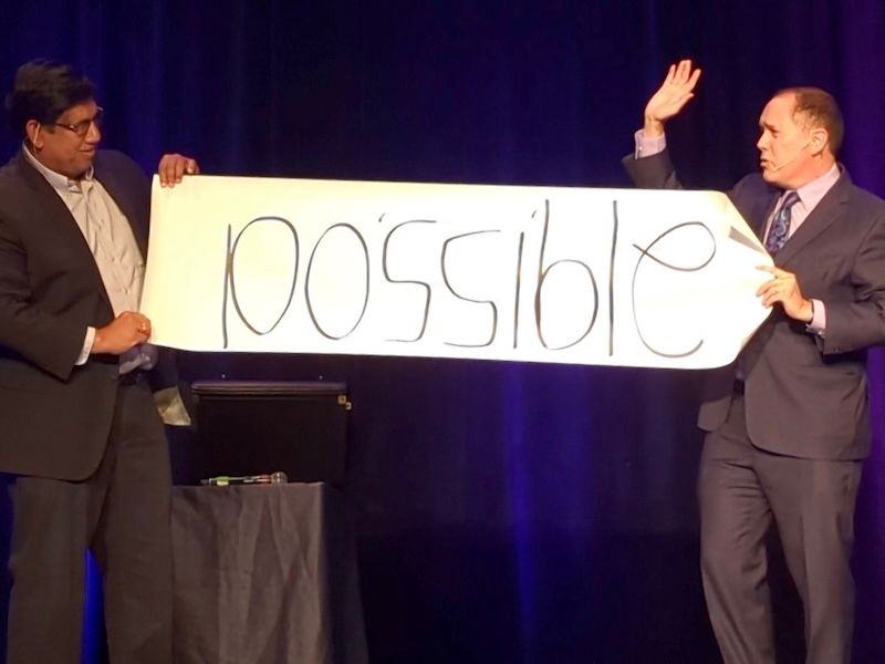 San Francisco corporate magician David Martinez performs on stage at a company engineering team event