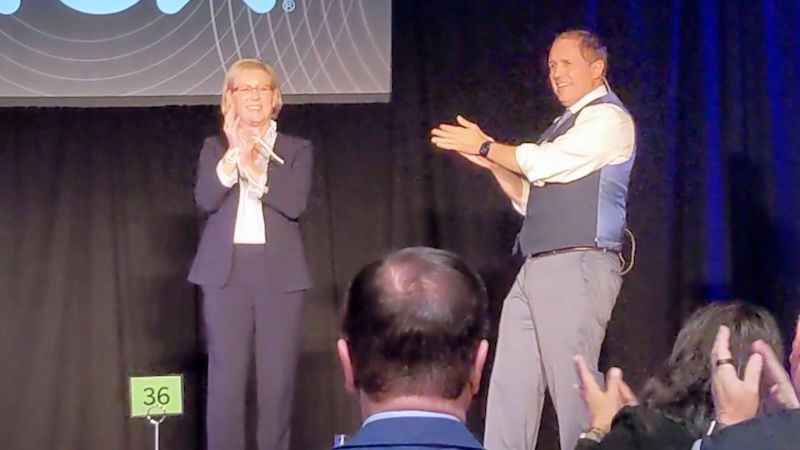 San Francisco Bay Area magician David Martinez wows an executive on stage at a company event