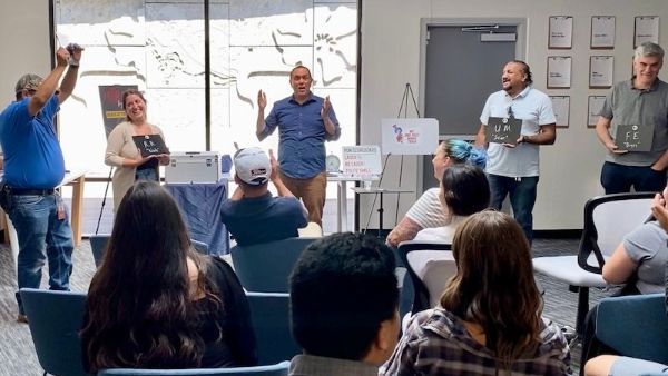 Magician David Martinez leads a team-building event at a local company