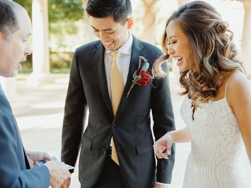 Wedding magician David Martinez wows a bride and groom with magic at their reception
