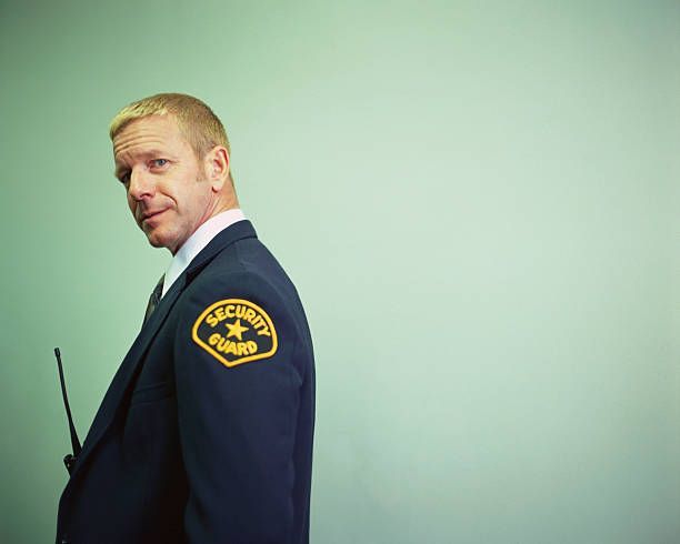 Male security guard with a Walkie-Talkie.