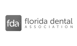 The logo for the florida dental association is black and white.