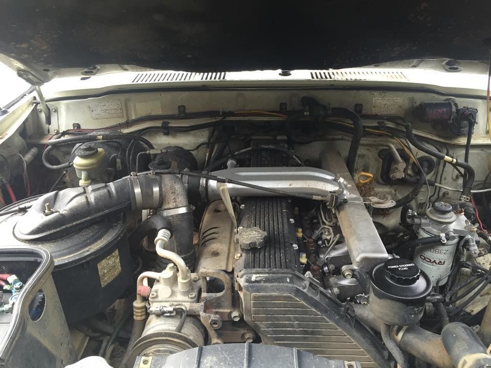 View of a Car Engine Under an Open Hood