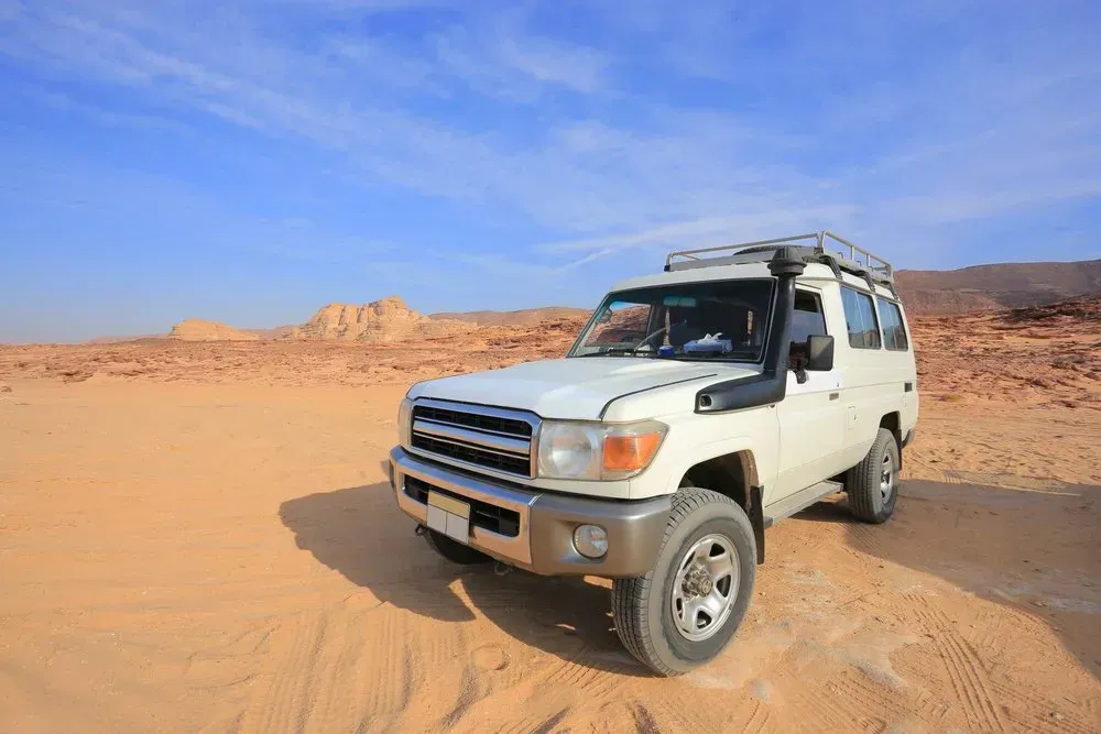 A White SUV is Parked in the Middle of a Desert — Shoalhaven Diesel Tech in South Nowra, NSW