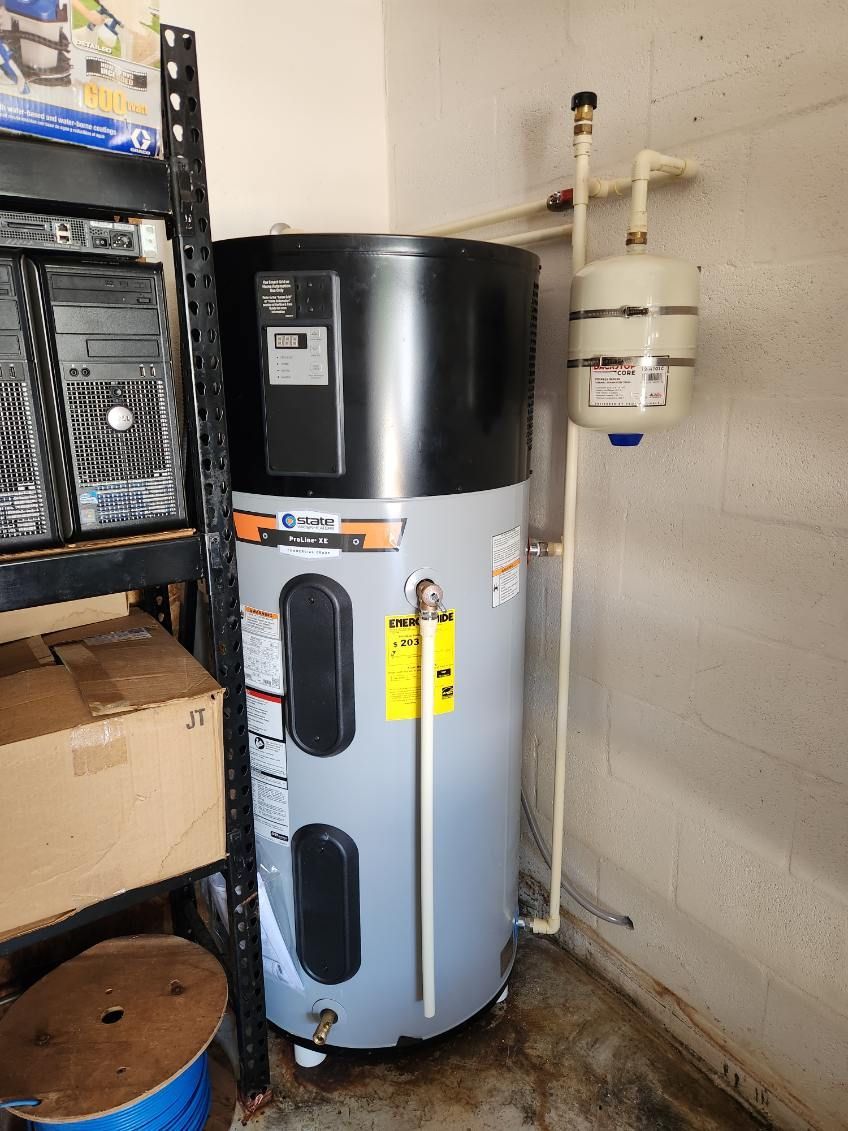 Water heater with an expansion tank in a garage.