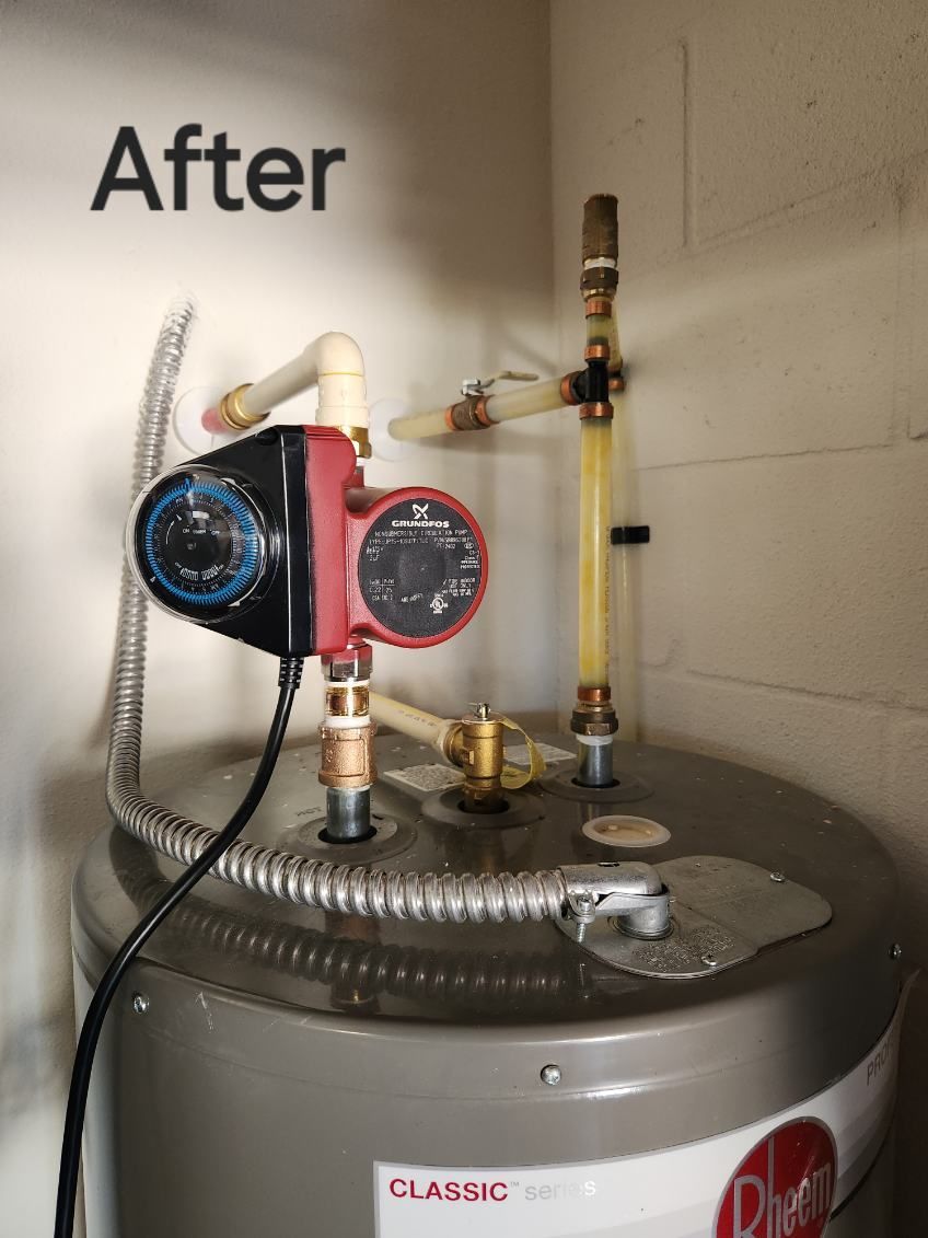 A water heater with a circulator pump and connected pipes in a utility room.