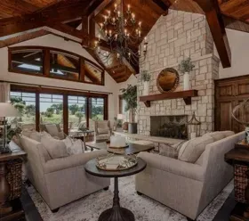 A living room filled with furniture and a fireplace.