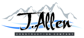 A logo for j allen construction company with mountains in the background