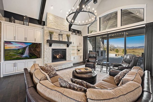 A living room filled with furniture and a fireplace.