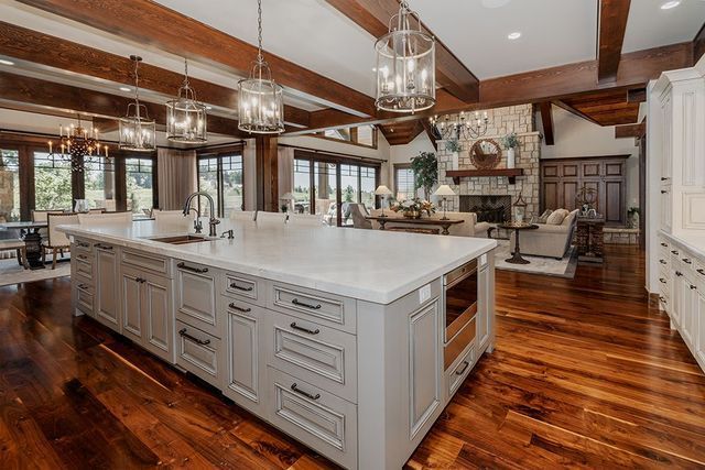 There is a large island in the middle of the kitchen.