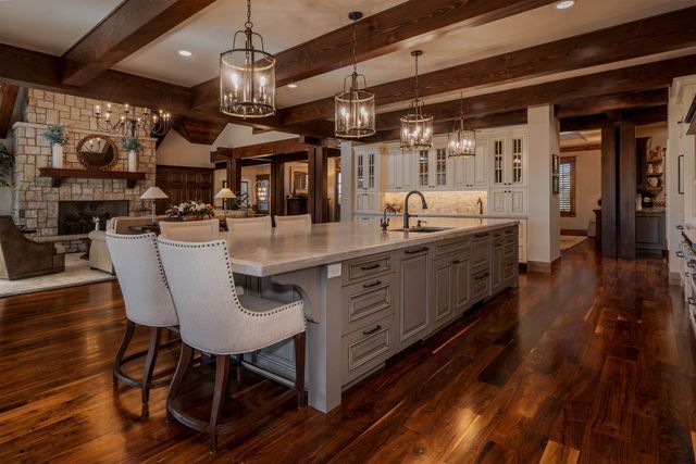 There is a large island in the middle of the kitchen.