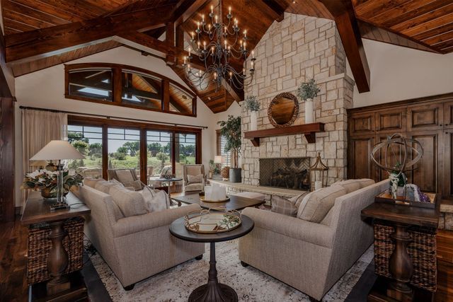 A living room filled with furniture and a fireplace.