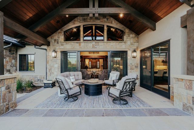 There is a fire pit in the middle of the patio.