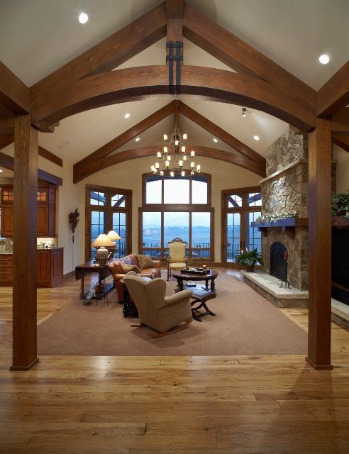 A living room with lots of furniture and a fireplace