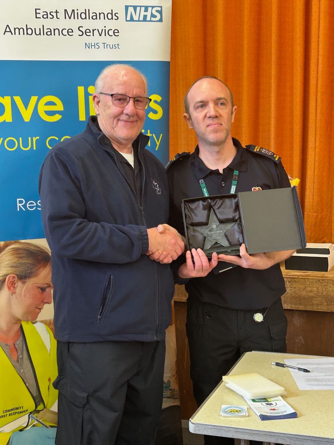 Coordinator Martyn Johnson presents Colin Gibson with an award for his 20 years of dedication to FVFR. 