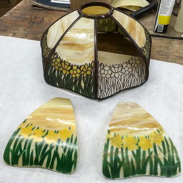 A stained glass lamp sitting on top of a table