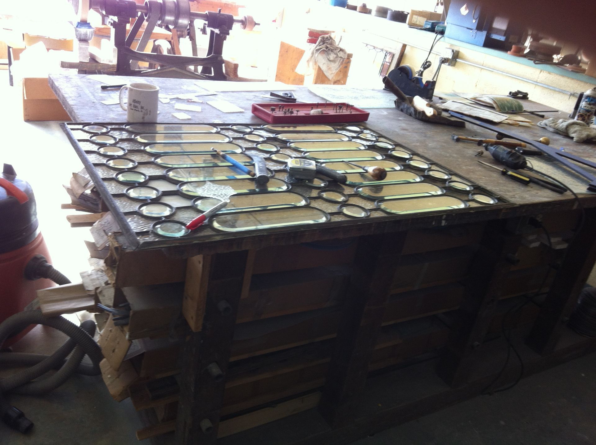 A table with a lot of pieces of glass on it