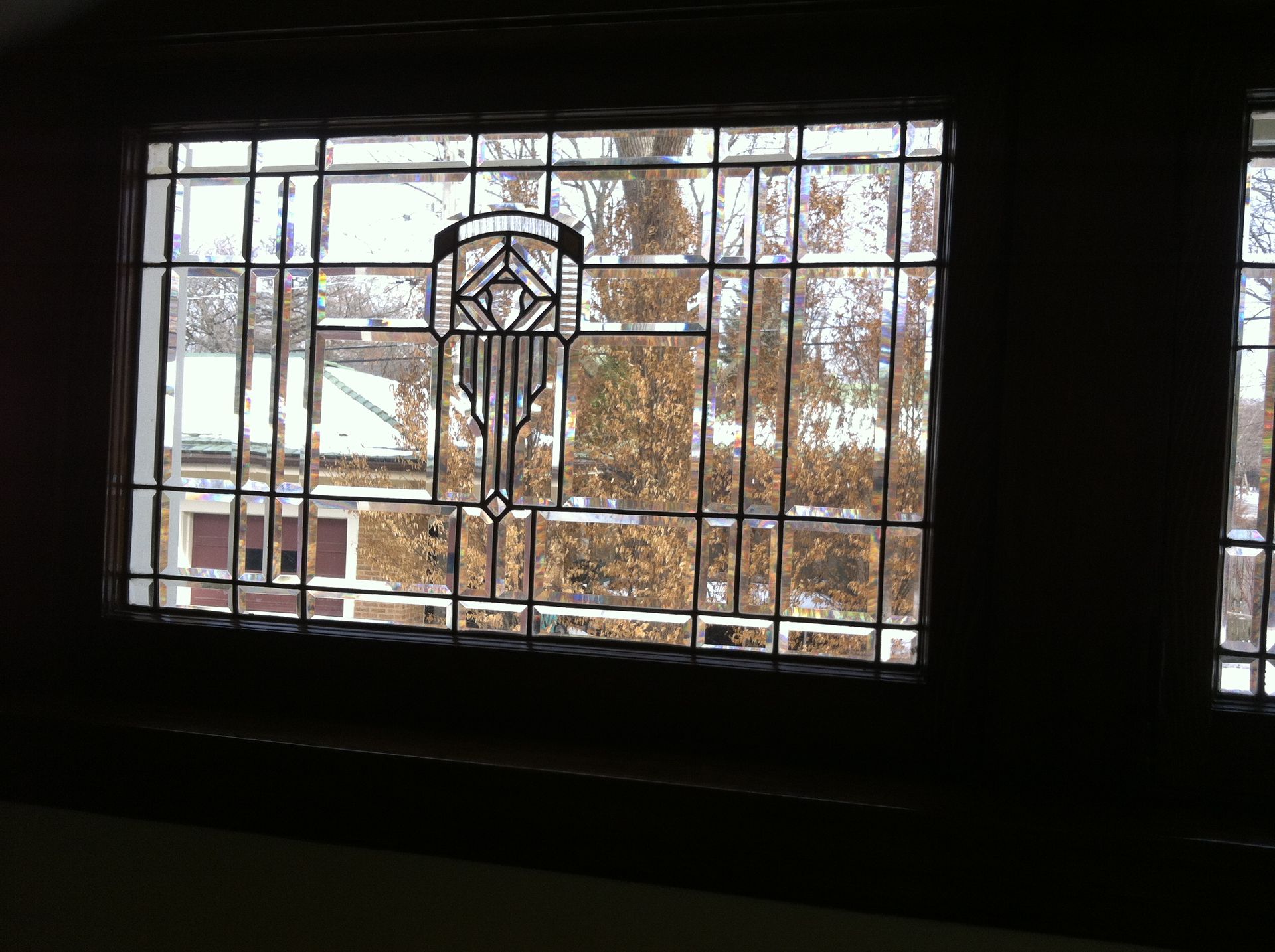 A stained glass window with a geometric design on it.