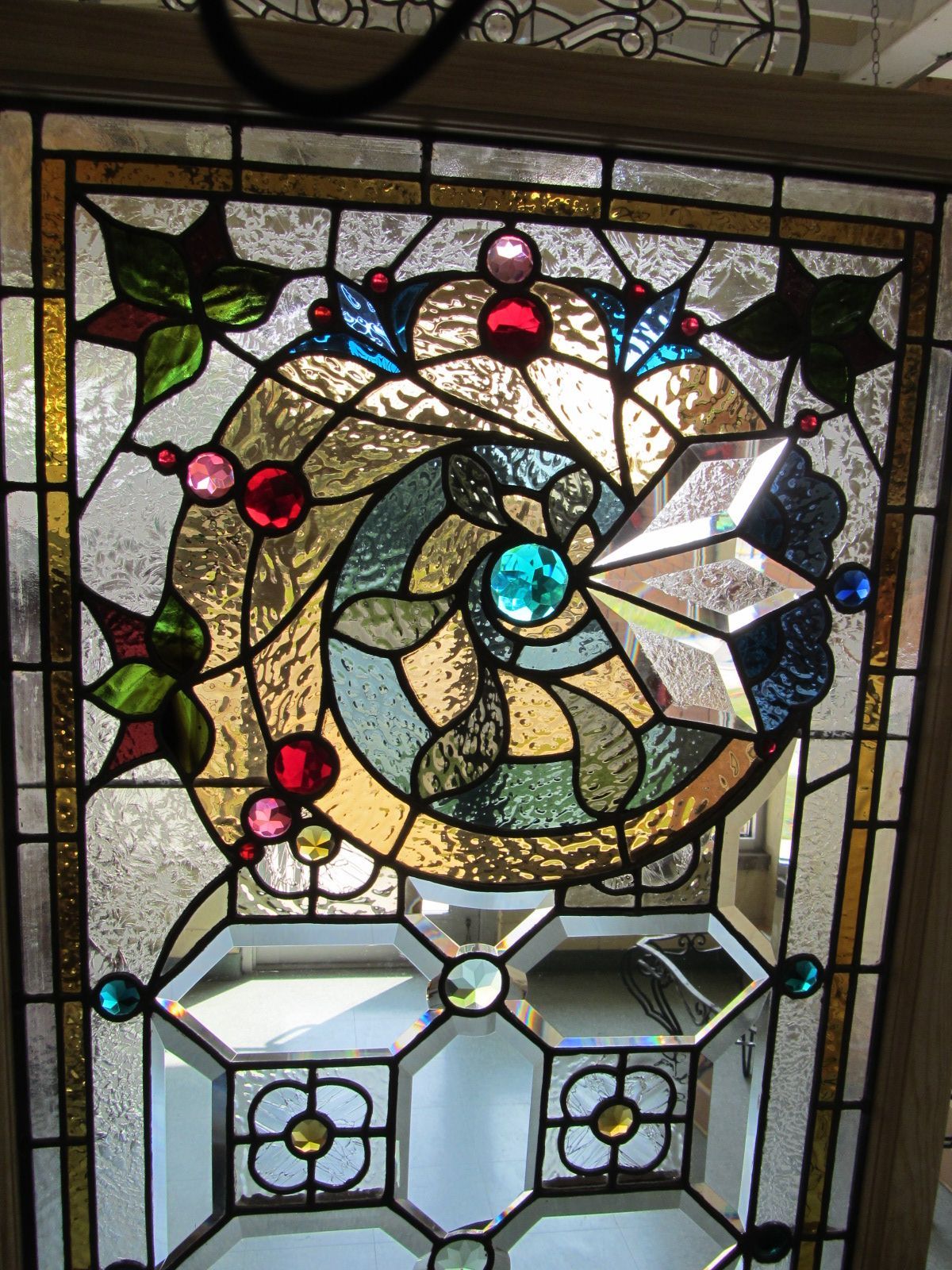 A stained glass window with a spiral design on it