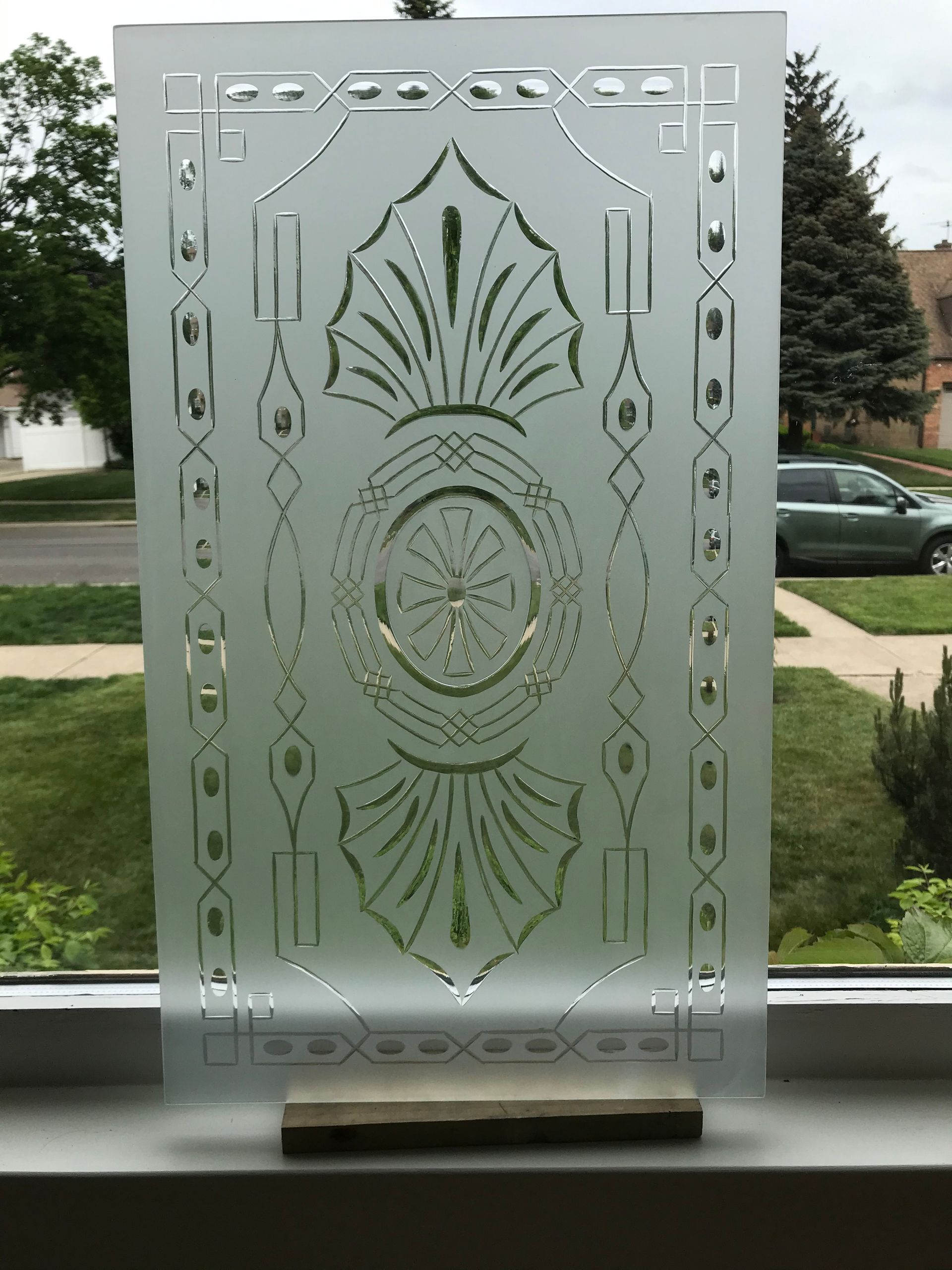 A stained glass window with a circular design on it