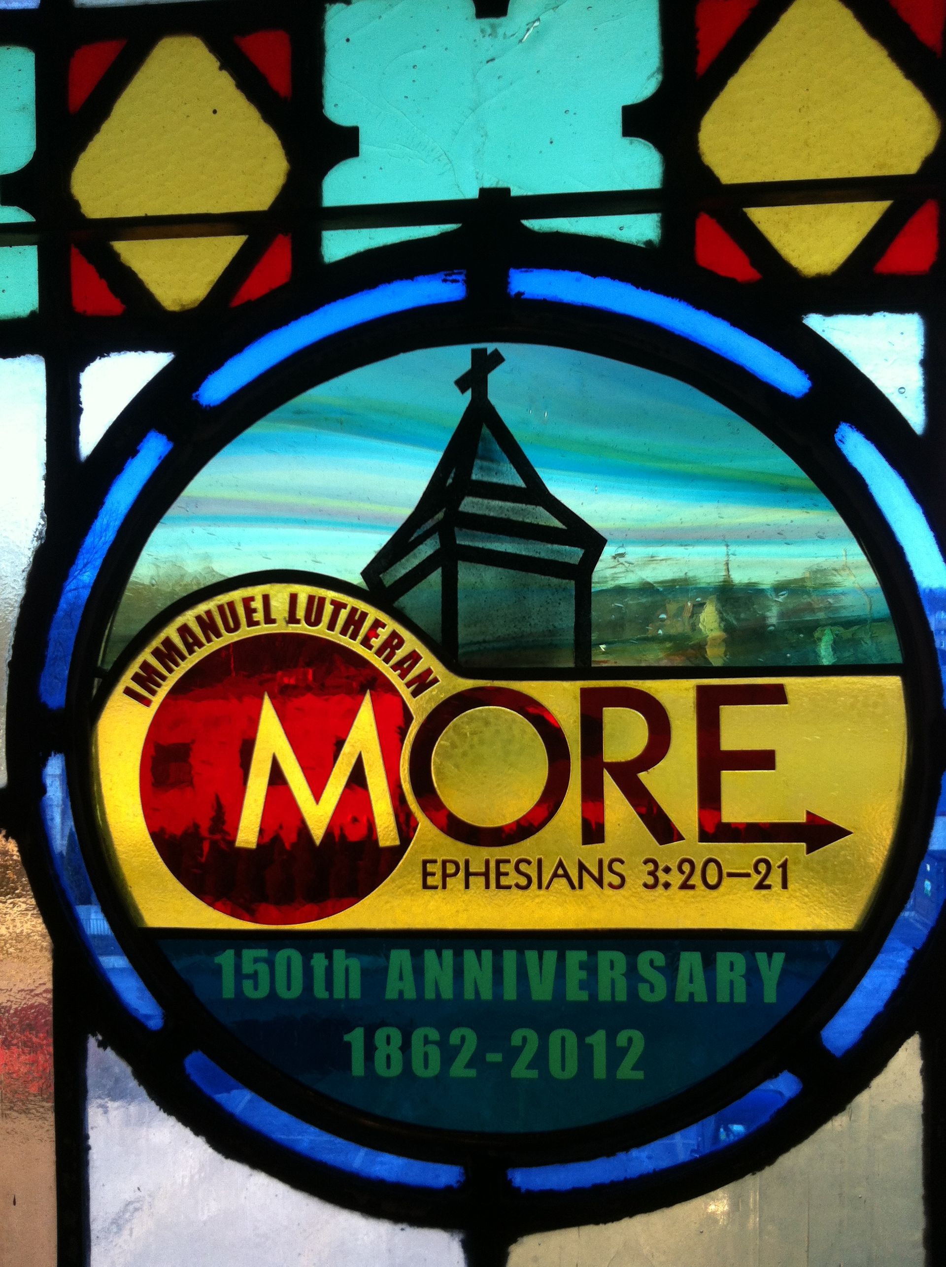 A stained glass window commemorates the 150th anniversary of the church