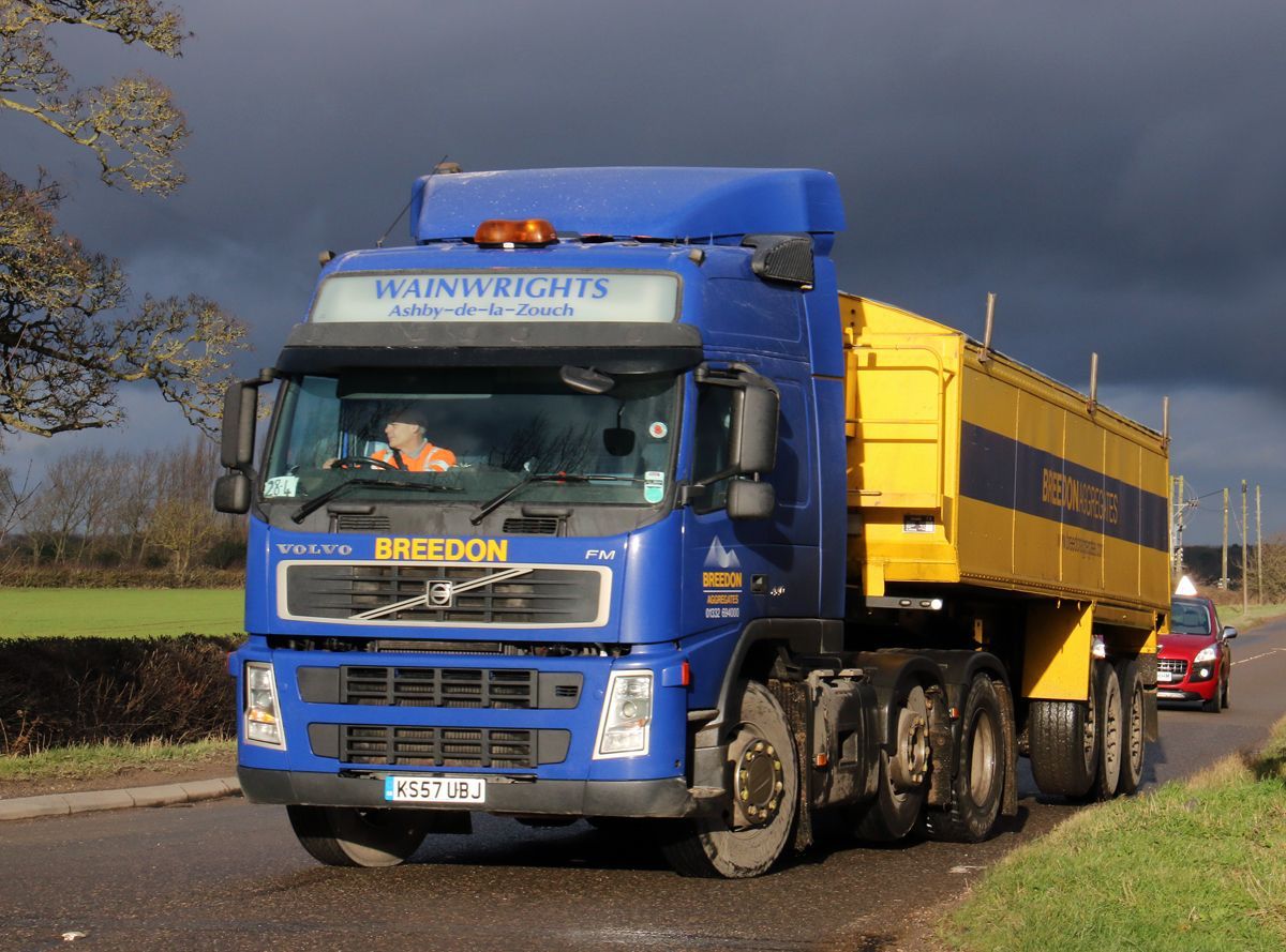 Blue and yellow semi-truck with the name 