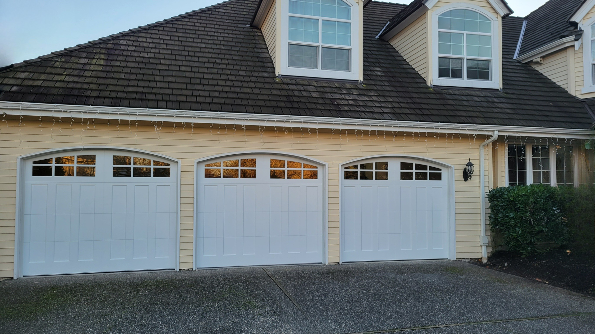 Triple car garage with steel carriage house garage doors shown by Garage Tech in Bothell Washington