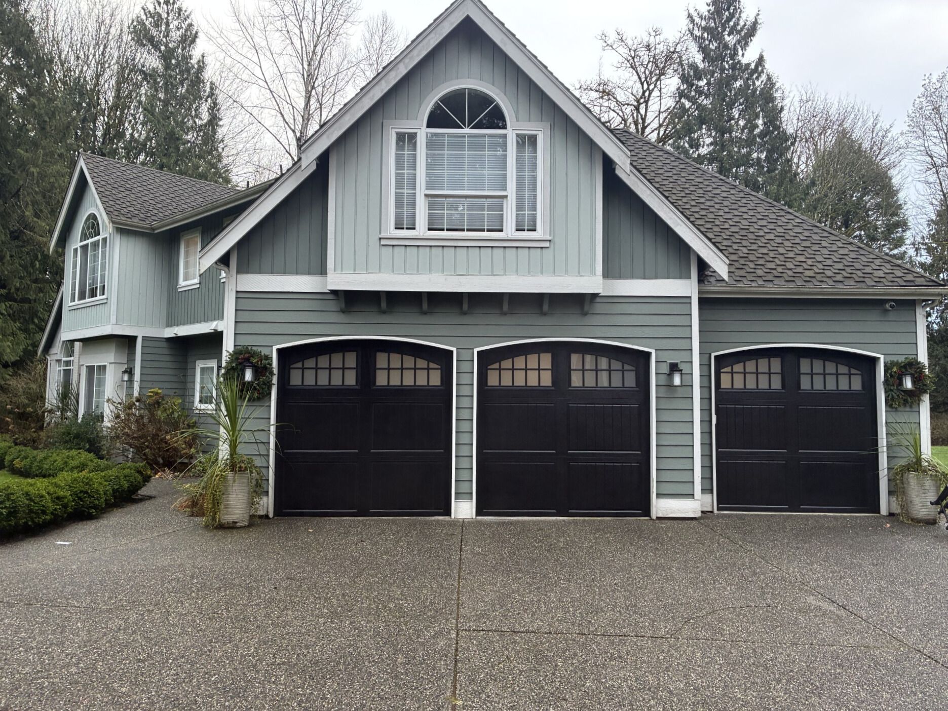 Residential steel carriage garage doors with refined styling by Garage Tech serving Kirkland, WA