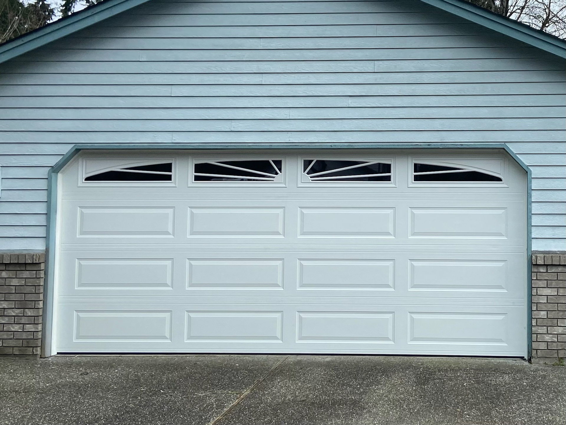 Steel carriage garage door with traditional visual depth by Garage Tech serving Everett, WA
