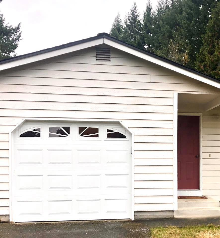 Steel carriage garage door with familiar carriage design by Garage Tech serving Mill Creek, WA